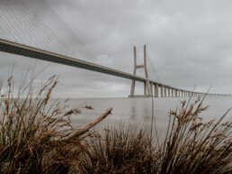 ponte vasco da gama lisbon on a cloudy day with gras