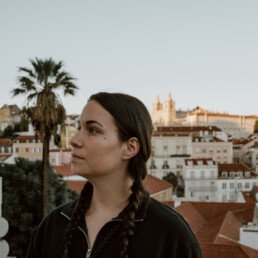 women enjoying the sunset in lisbon alfama quarter